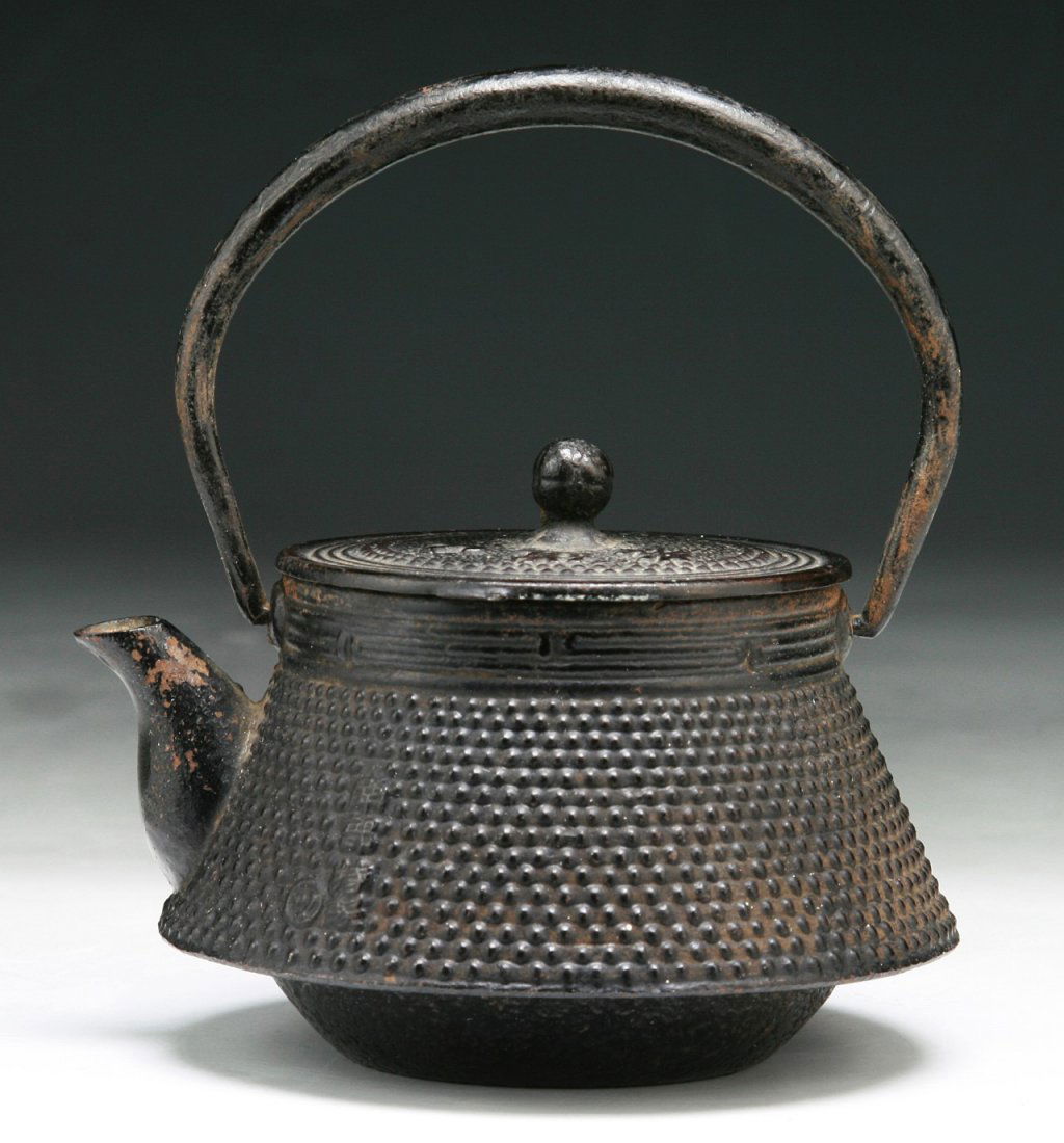 A Japanese Antique Iron Teapot: A Japanese Antique Iron Teapot: circa 1900; Dimension: H: 5"; L; 4-1/2"