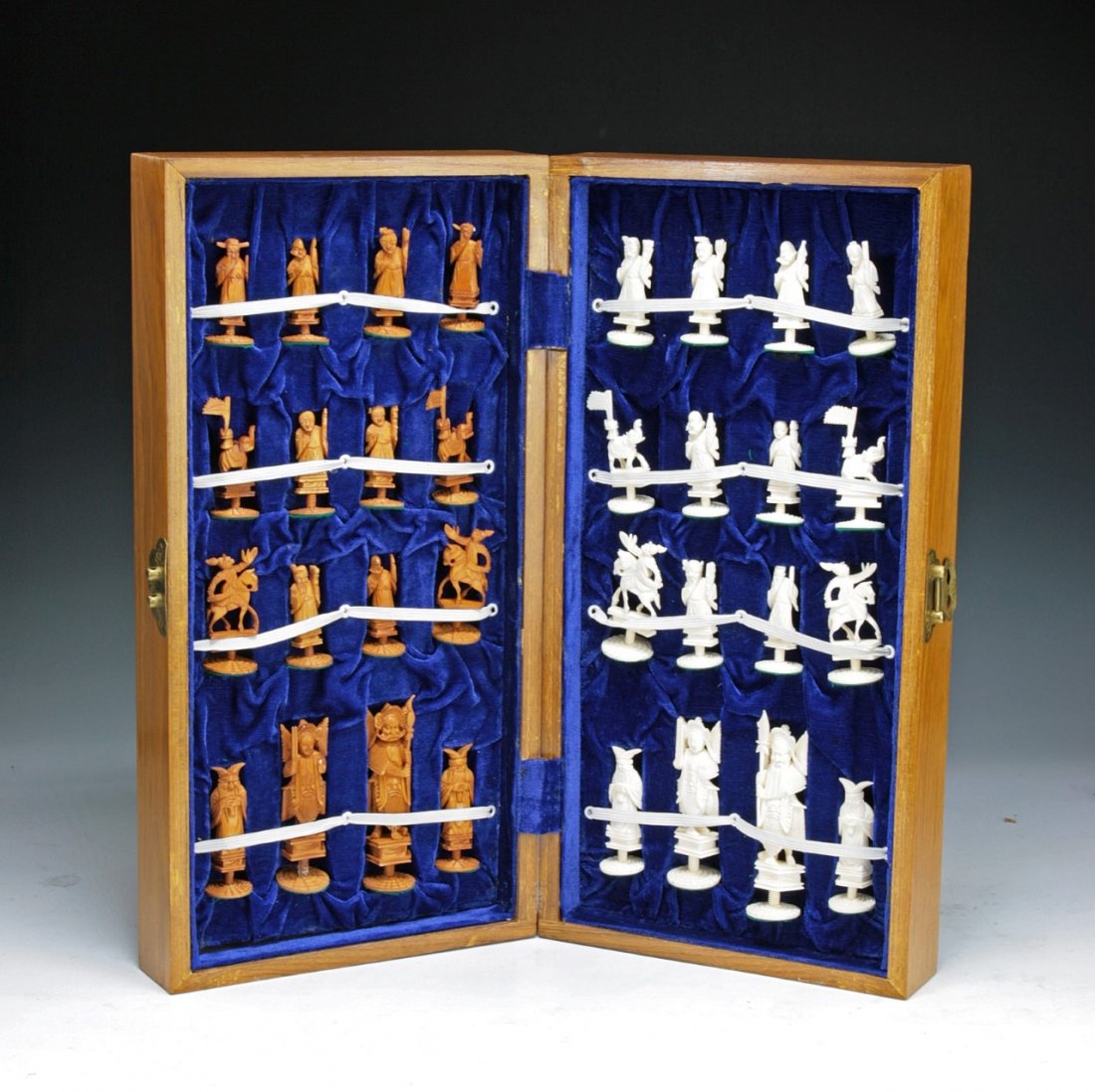 A Complete Set Of Chinese Carved Ivory Chess: A Complete Set Of Chinese Carved Ivory Chess: all pieces present, good condition, in wood box, of late 19th/early 20th Century; Dimension: Size: H: 4-1/4" (biggest)