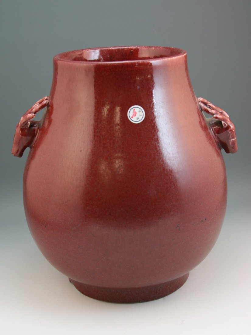 Antique Chinese Ox-Blood Red Glaze Porcelain Zun: Antique Chinese Ox-blood red glaze porcelain Zun: with two deer head handles; with an old Chinese antique inspection sticker; 19th century; Size: H: 12-1/2"
