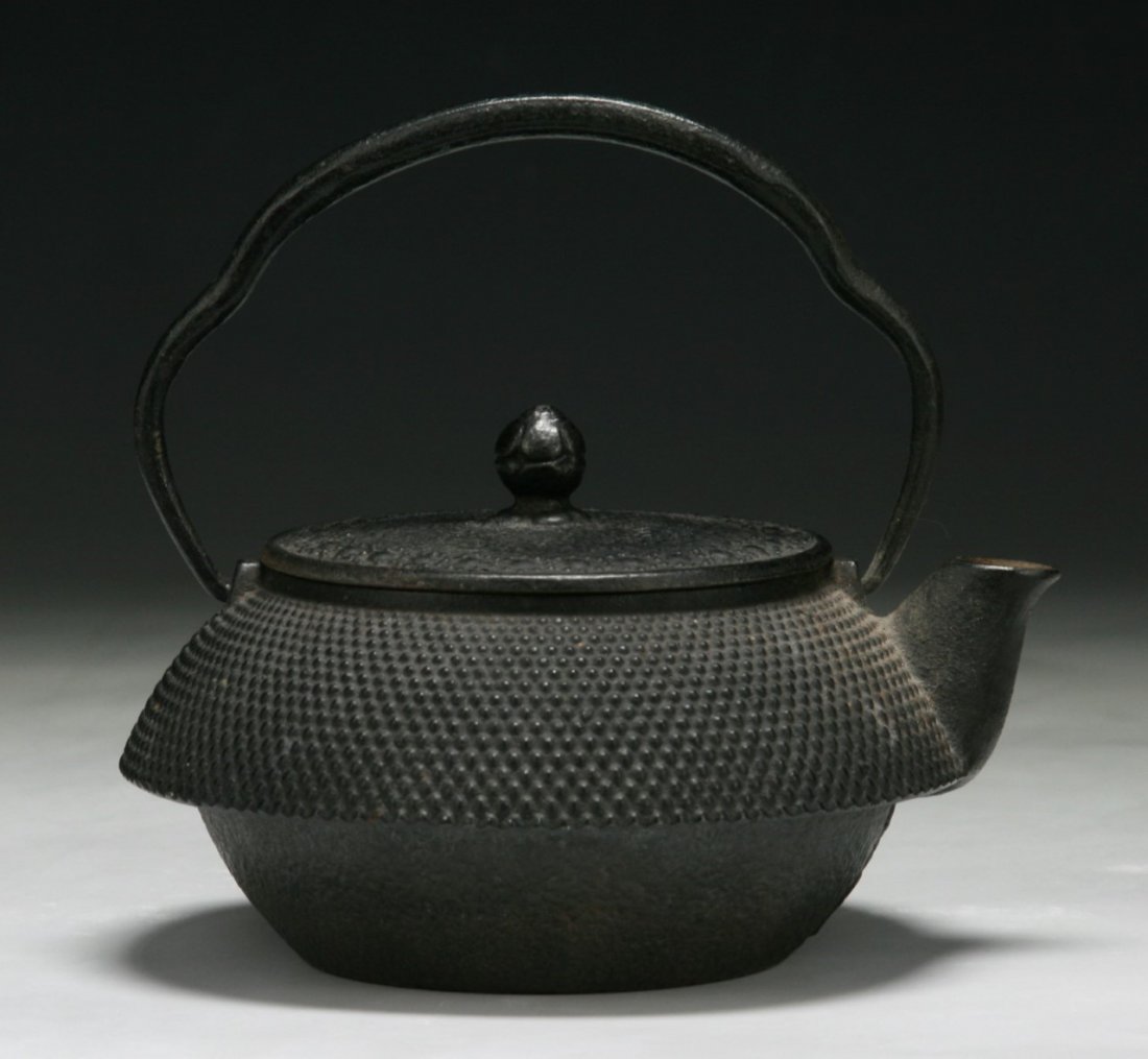 An Antique Japanese Iron Teapot: An Antique Japanese Iron Teapot; Size: H: 5-1/2"; L: 6-1/4"