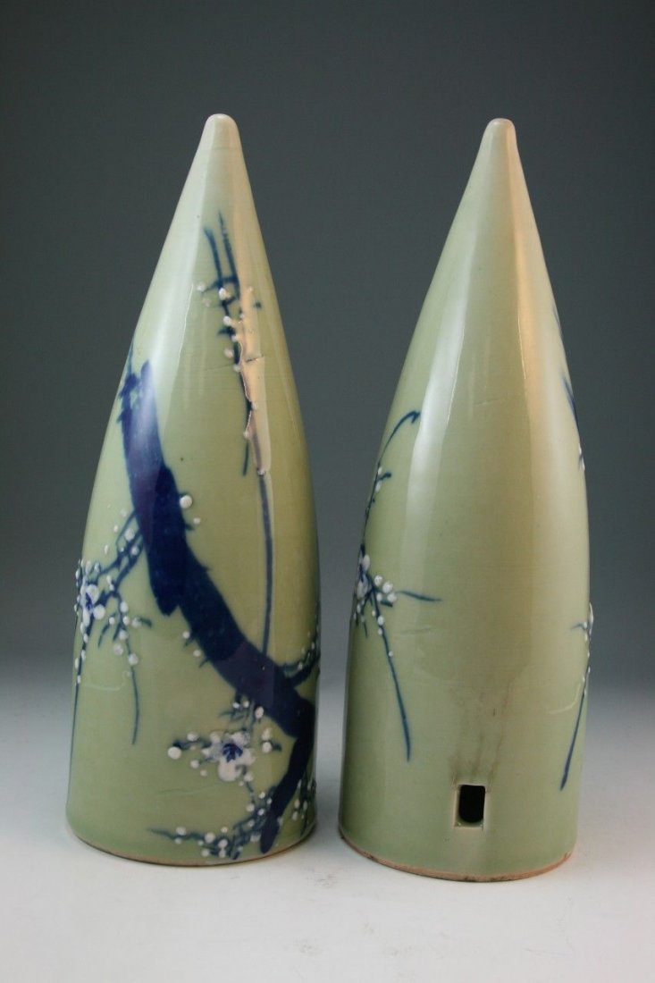 Pair Japanese Antique Celadon Glazed Porcelain Cones: Pair Japanese antique porcelain cones: blue and white with celadon glaze; with the design of flowering plum blossoms; late 19th/early 20th century; Size: H: 13"