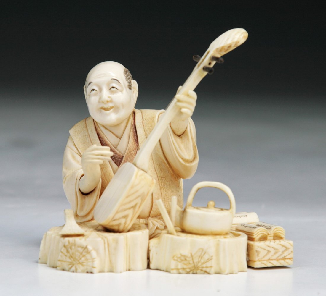 A Japanese Antique Ivory Carved Figure: A Japanese Antique Ivory Carved Figure: signed on the base; Size: L: 3-1/2"
