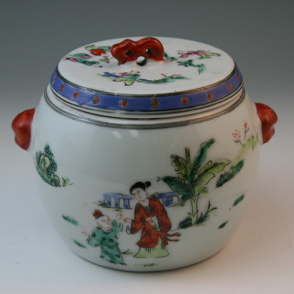 Chinese "Wucai" Porcelain Lidded Jar: with ladies and kids playing in the garden; with red handles; with square red six character "Tongzhi" mark; Size: H: 5-1/2"