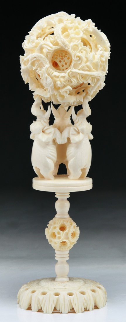 A Chinese Antique Ivory Carved Puzzle Ball With Stand: A Chinese Antique Ivory Carved Puzzle Ball With Stand; Size: H: 8-1/2"; (ball) D: 3"