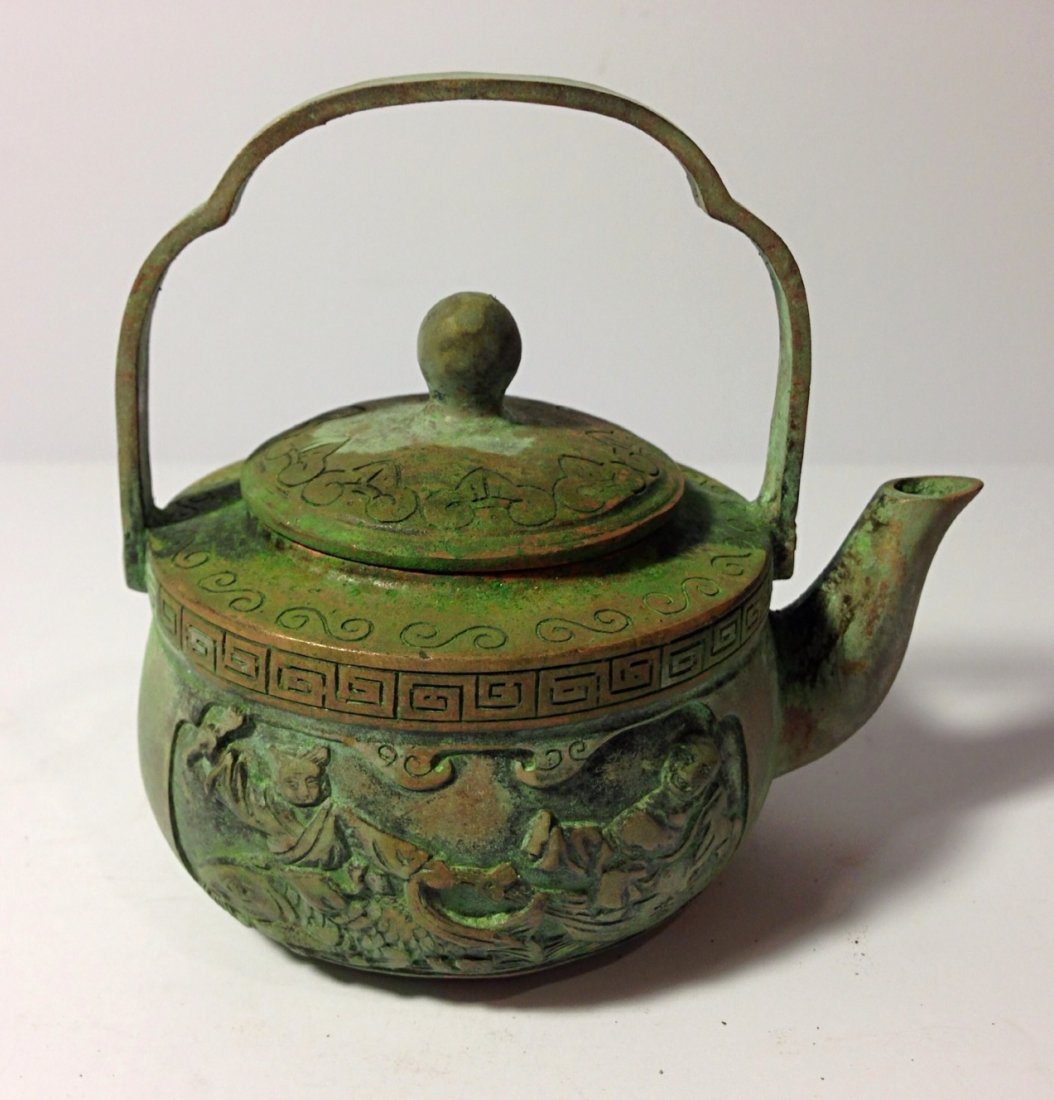 Chinese brass teapot: Sign on the bottom. H: 4 1/4". Diameter: 3 1/4".
