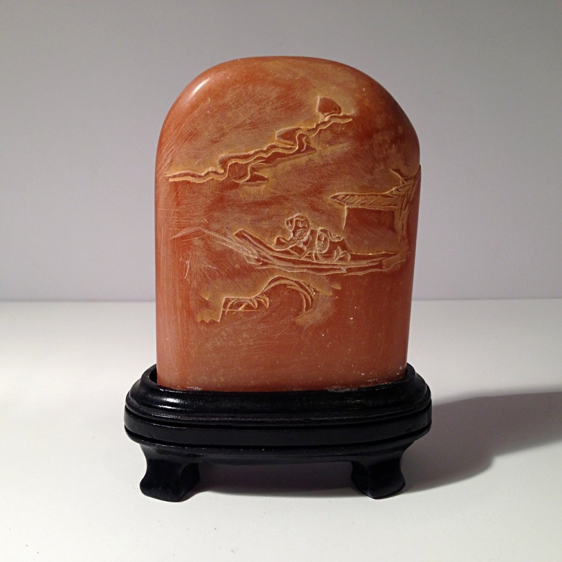 Carved soapstone with wood stand: Measurements: H: 4 1/4". W: 2 3/4".