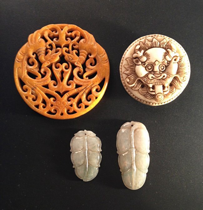 4 Pcs Jade carvings: Measurements: Diameter: 2 1/2" & 1 7/8". H: 1 1/4" & 1 3/4". W: 3/4" & 7/8".