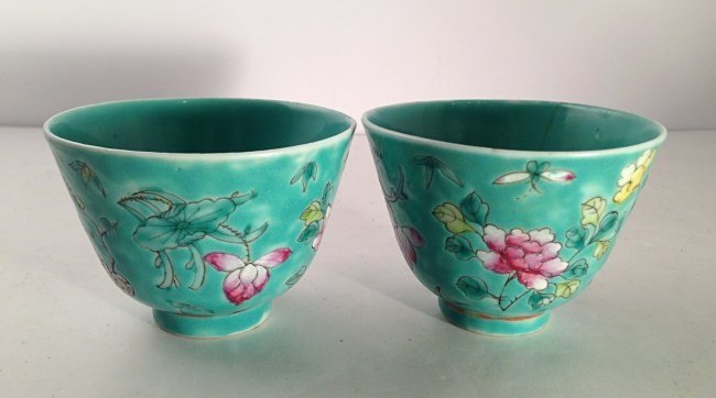 A pair of Chinese porcelain cups: Measurements: H: 2 1/4". Diameter:3 1/4".