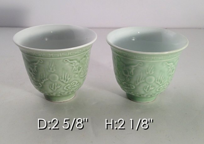 A Pr.of Chinese light green Porc. wine cups with dragon: Measurements see picture