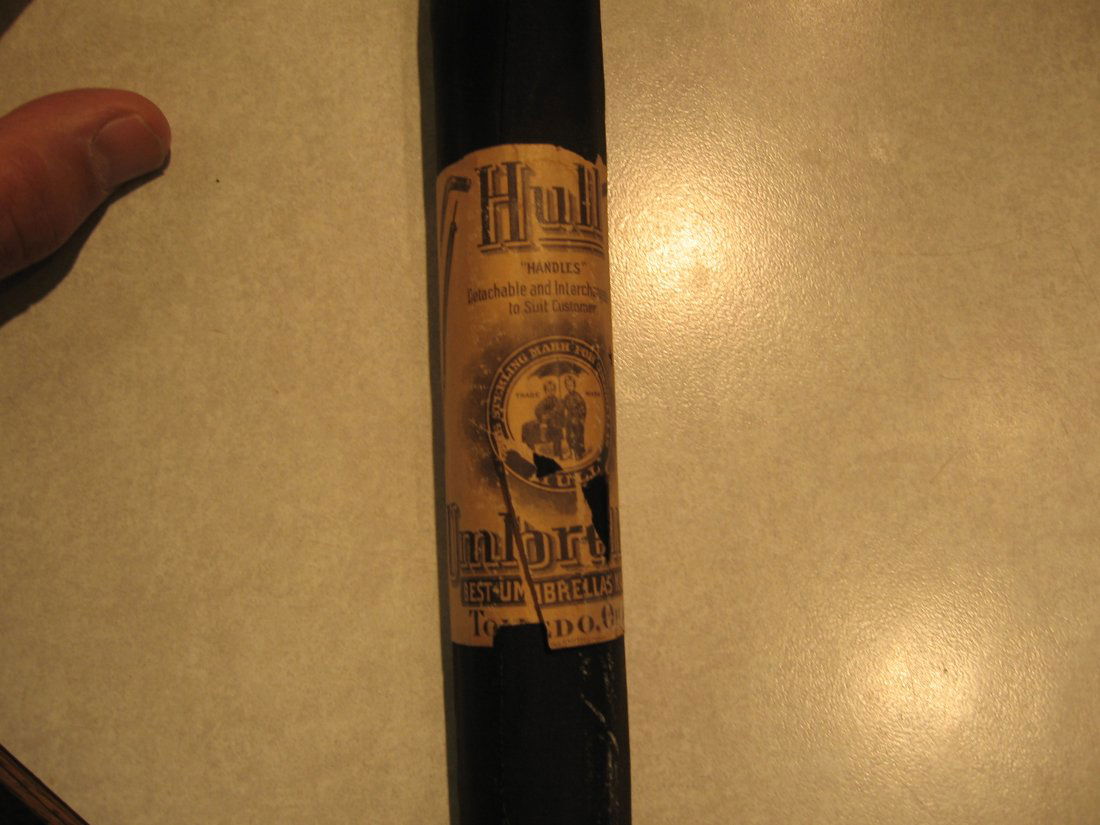 HULL SILK UMBRELLA / WALKING CANE: Up for sale is an extremely rare unused turn-of-the-century Hull Silk Umbrella/Walking Stick with the paper wrapper seal still on! This umbrella has never been taken out of the slip cover. The gold p