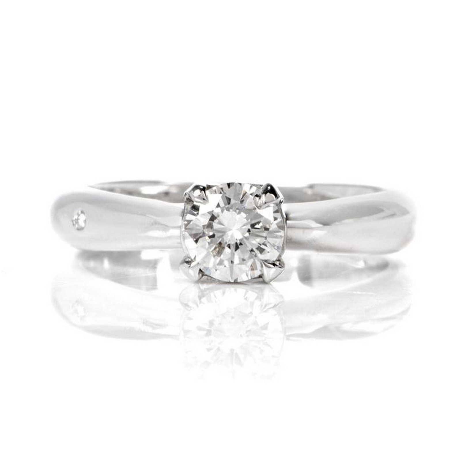 Chimento Diamond 18K White Gold Italian Engagement Ring: This classic diamond Italian made engagement ring is crafted in 18-karat white gold. Centered is a single prong set round-brilliant diamond weighing approximately, 0.57 carats, graded H color, and VS1
