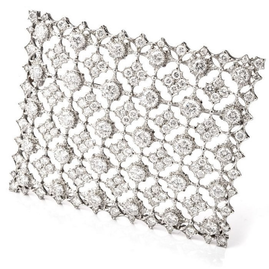 Mario Buccellati Vintage Diamond Window of Snowflakes Platinum Brooch: Weighing appx. 19.8 grams, this solid brooch contains diamonds weighing appx. 7.40 carats and are of F-G color and VS1-VS2 clarity.
