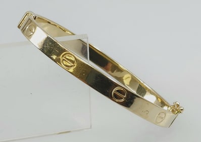 Cartier style 14k yellow gold screw bracelet