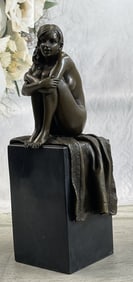 Mavchi Woman Sitting on a Rug Bronze