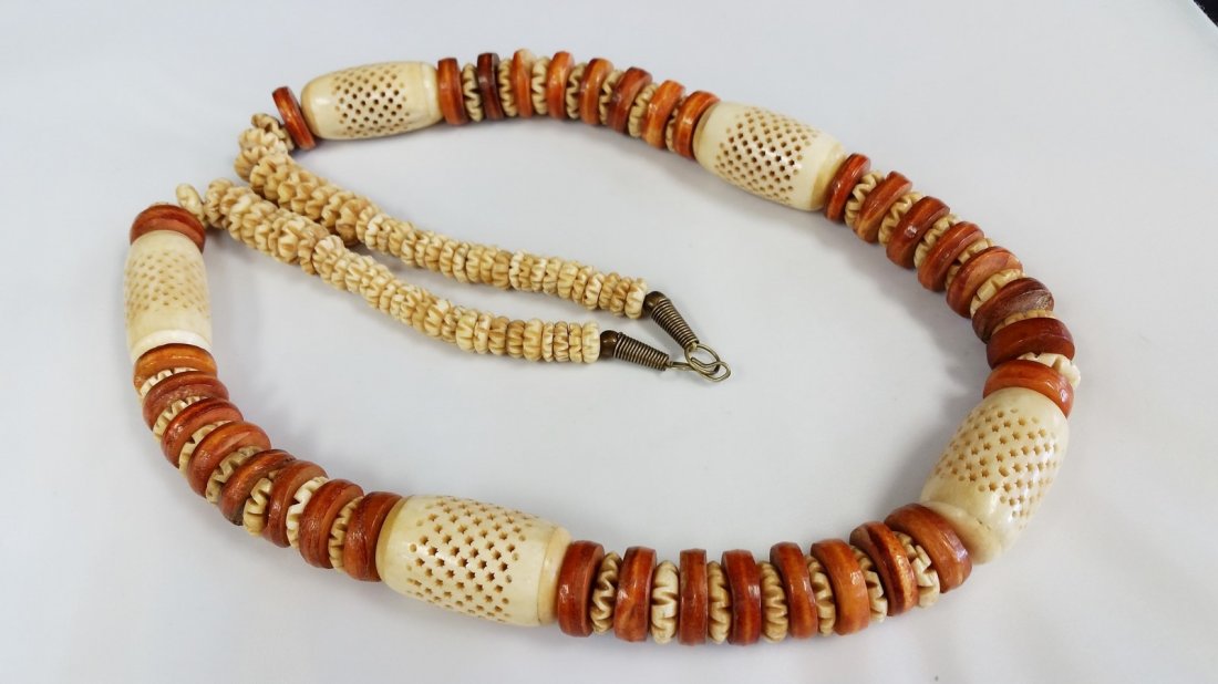 large antique hand carved bone or ivory necklace: 36" long and very heavy 280.80 grams, the bone or ivory bead is 1.50" x 1"