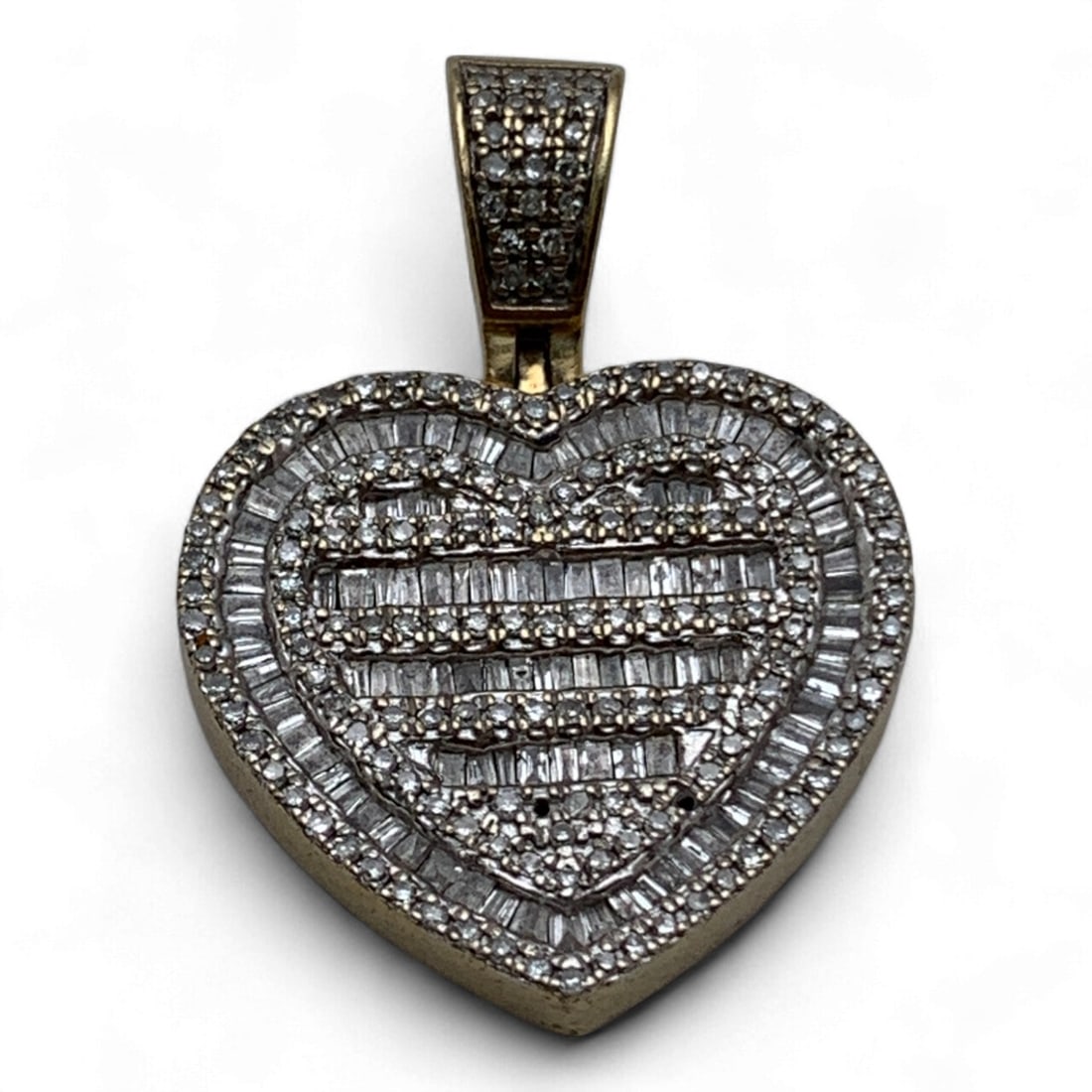 10k Gold And Diamond Heart Pendant: Tests 10k Gold. 3.9 Dwt. 1.25" Long.