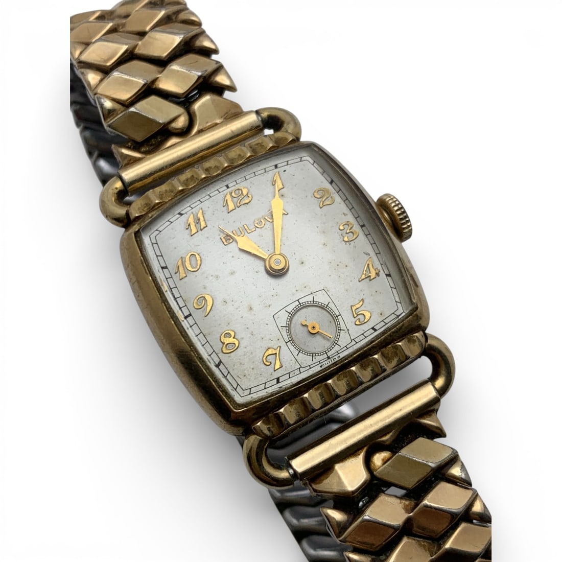 Bulova 12k Gold Filled Stretch Band Wrist Watch: Marked On Face: BulovaMarked On Back: Bulova, Bulova, 4618828Marked On Band: 1/20 12k G.f. Top7/8" Face Diameter - 40.0 Grams