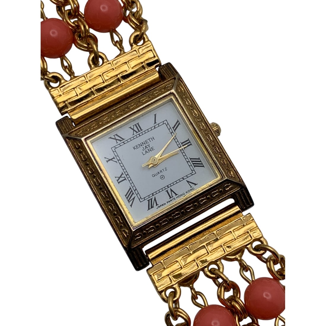 Kenneth Jay Lane Gold Tone Watch W Pink Beads: Marked On Face: Kenneth Jay Lane, QuartzMarked On Back: Kjl, Stainless Steel Back, Base Metal Bezel, Hong Kong7 1/2" Long - 1" Face Diameter