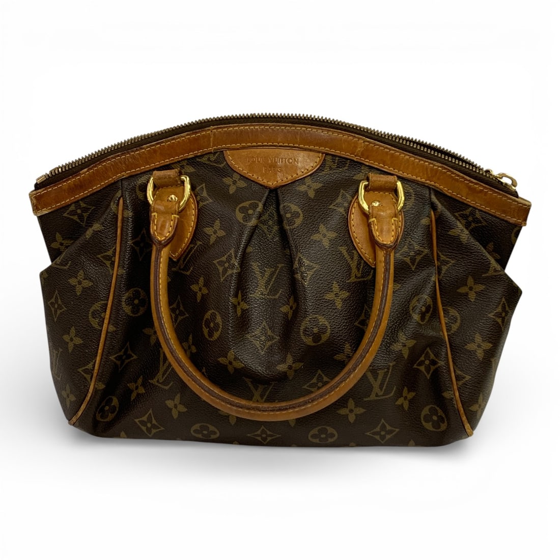 Vintage Louis Vuitton Monogram Tivoli Handbag: Marked On Front: Louis Vuitton Paris.Label On Inside: Louis Vuittonvintage Bag, Shows Some Wear, See Photos. Paris. Made In France. 9" X 14"Vintage Bag, Shows Some Wear, See Photos.