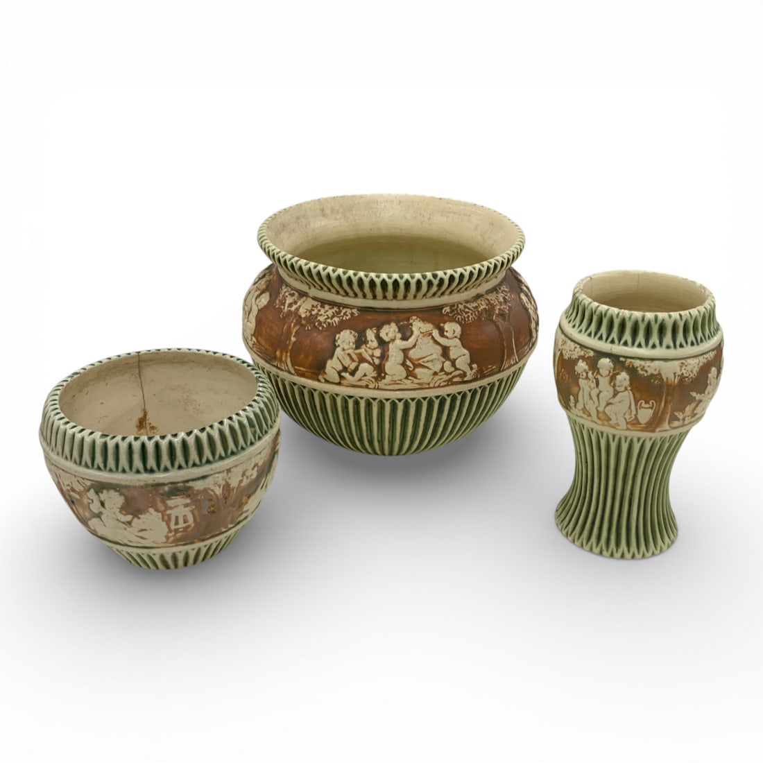 3 Pieces Of Roseville Pottery In Donatello Pattern: Large Bowl: 11 1/2" Diameter - Medium Bowl: 7 1/4" Diameter Vase: 10 1/2" TallAll Three Pieces Show Damage