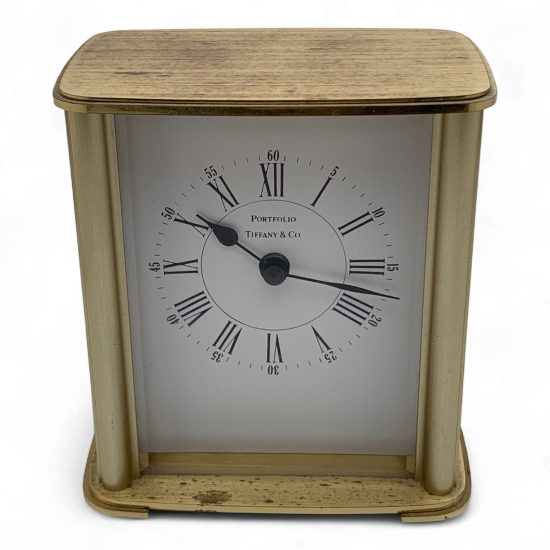 Tiffany & Co. Portfolio Brass Desk Clock: Face Marked: Portfolio. Tiffany & Co. Battery Operated: Quartz 2100. Made In Germany. 4" Tall.