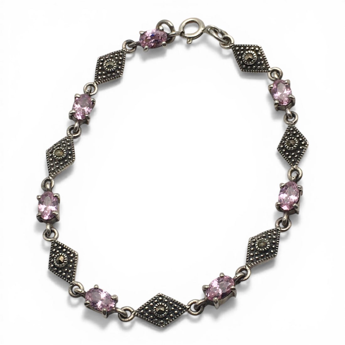 Sterling Silver Bracelet With Pink Stones: Marked 925. 7.25" Long. 7.5 G.