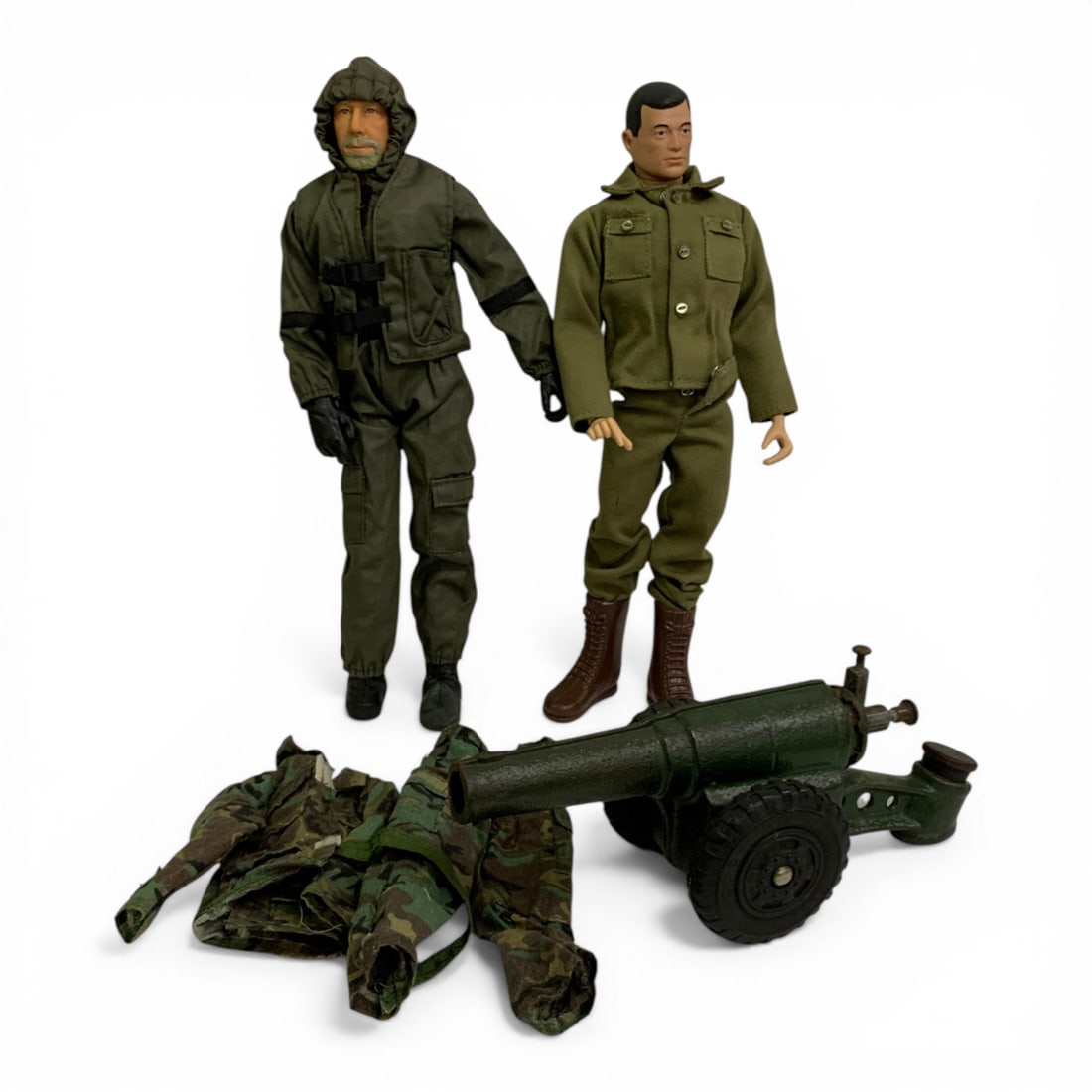 Group Of Military Toy Items: Includes 2 G. I. Joe Dolls, 1 Cast Iron Cannon & One Extra Military Outfit