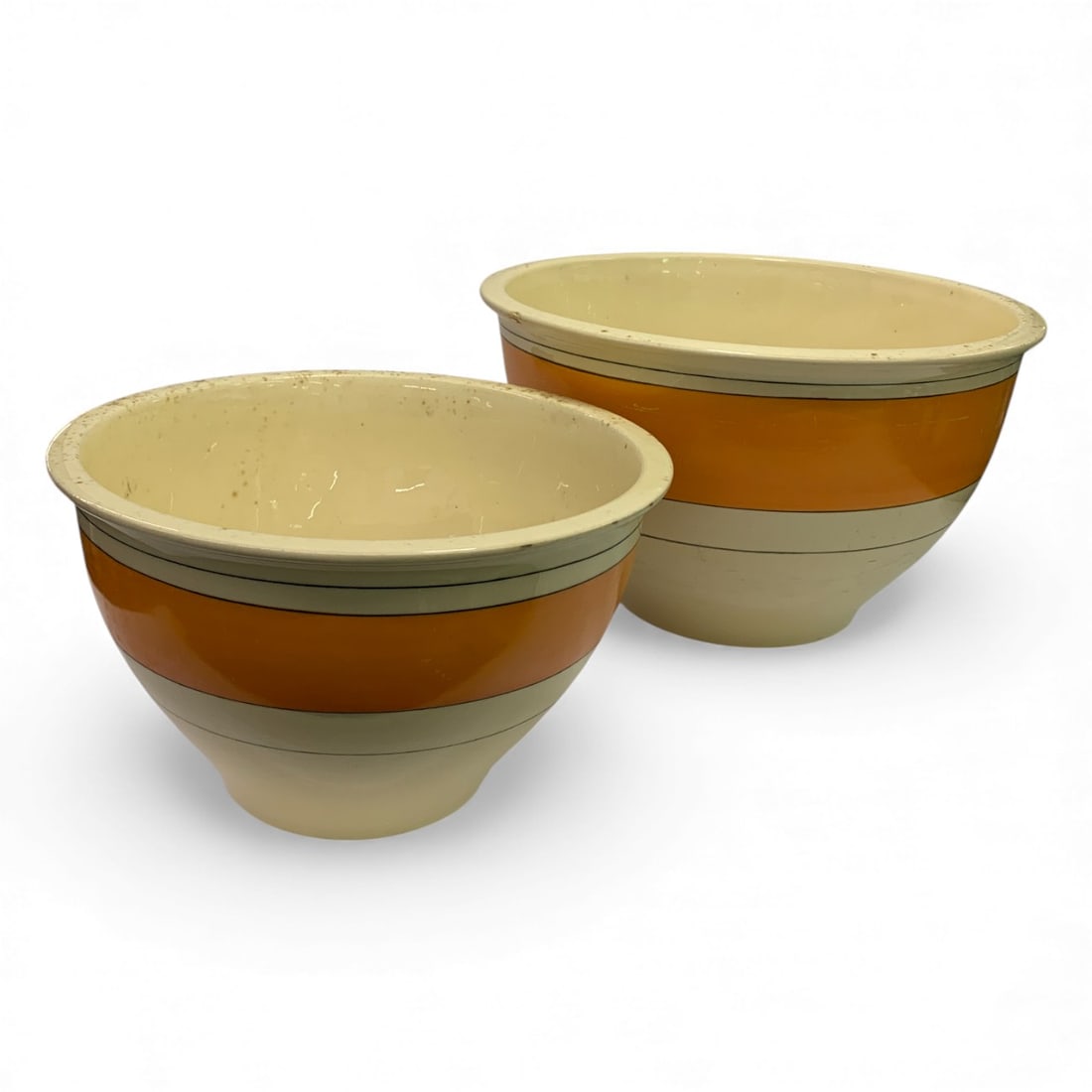 2 Roseville Pottery Nesting Mixing Bowls: Bear Roseville R Mark On Bottom. Orange Stripe Design. 7" Tall X 11.5" Diameter & 9.25" Diameter Bowls. As - Found, Shows Damage And / Or Restoration, See Photos.