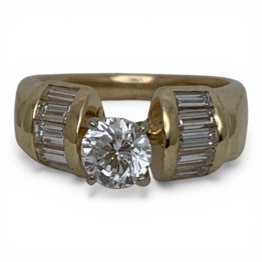 Vintage 14k Gold & White Diamond Engagement Ring: Vintage 14k Yellow Gold Engagement Ring Featuring 1 0.75ct Brilliant Round Cut Center Diamond Flanked By 10 0.07ct Baguette-cut Diamonds. Approx 1.45cwtMarked: 14k - Size 6 - 3.8 DwtGemstones Tested W