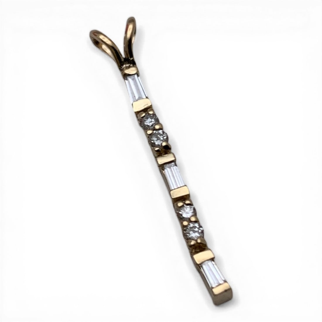 18k Yellow Gold & Diamond Pendant: 14k Yellow Gold Pendant Featuring 4 Round Cut Diamonds Approx. 0.025ct Each And 3 Baguette Shaped Diamonds Approx. 0.025ct Each. 7 Total Diamonds & 0.275ctw Of DiamondsTests 18k - 1 1/8" Long - 0.4 Dw