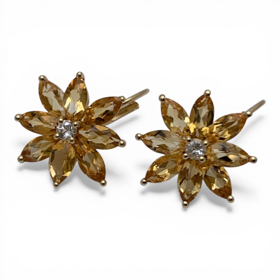 Pair Of 14k Gold & Citrine Floral Shaped Earrings: Pair Of Floral Shaped Dangle Earrings Featuring 8 Marquise Cut Orange Citrine Stones Surrounding 1 Round Cut Center Clear Spinel Stone Approx. .07ct Set In 14k Yellow Gold Marked: 14k - 3/4" Long - 1.