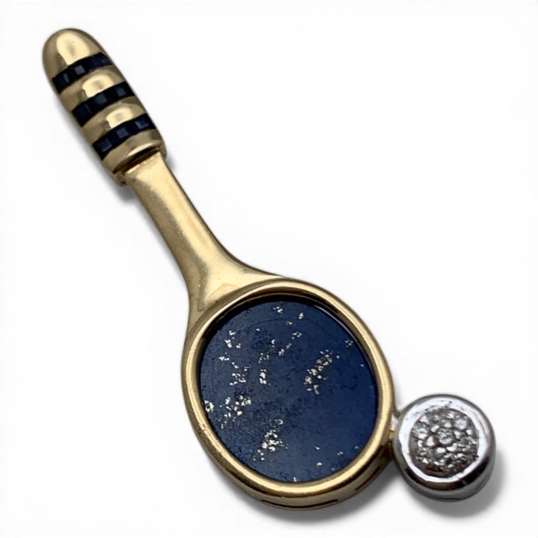 14k Gold Sapphire & Lapis Tennis Racket Pendant: 14k Yellow Gold Tennis Racket Pendant With 9 Princess Cut Blue Sapphires In A Channel Setting, A Oval Cut Lapis Lazuli Insert & 7 Round Cut Diamonds Approx. 0.014ct Each. Approx 0.098ctw Of Diamonds T