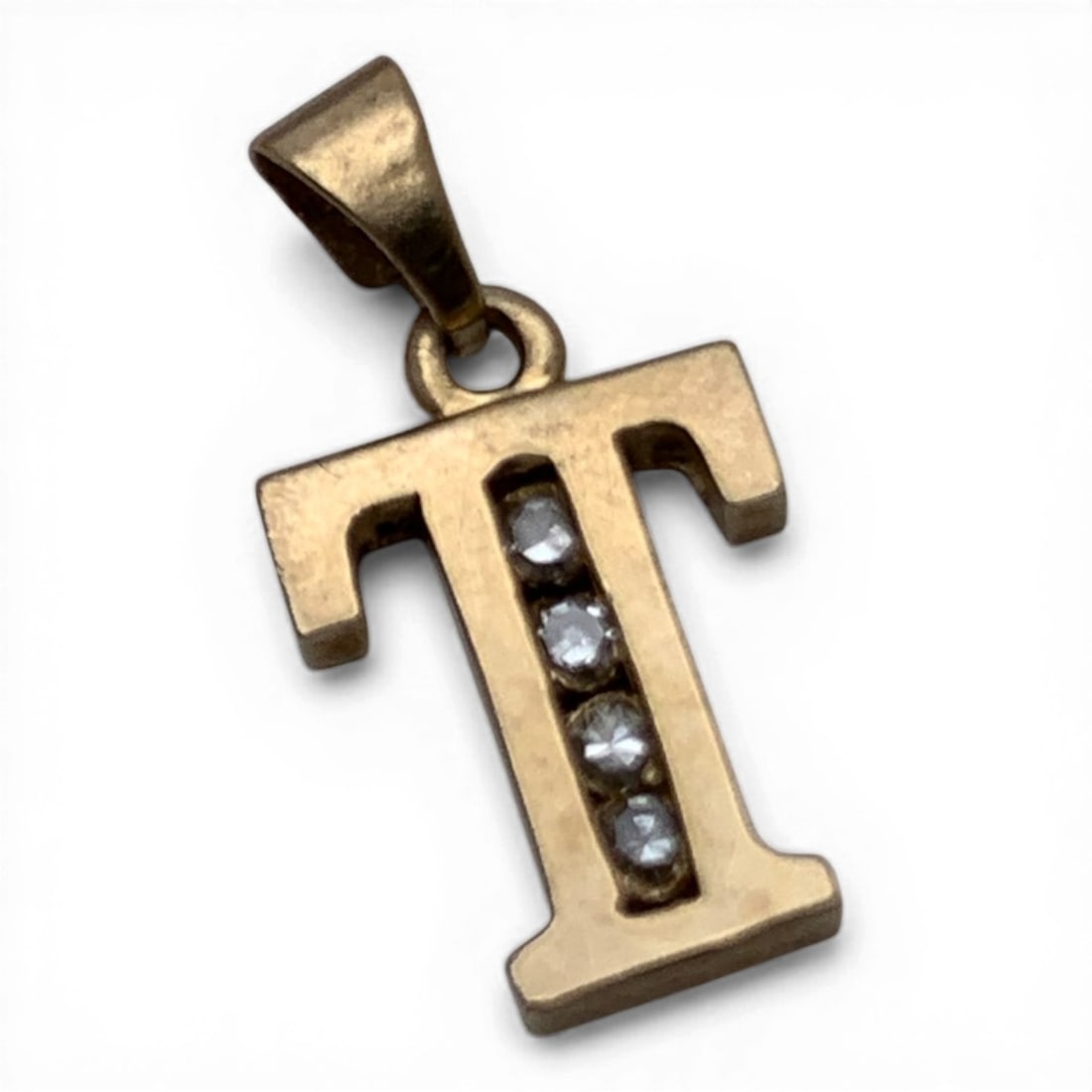 14k Yellow Gold & Diamond " T " Pendant: 14k Yellow Gold " T " Pendant Featuring 3 Round Cut Diamonds Set In The Middle Of The Pendant Approx. 0.025ct Each. Approx 0.075ctw Of Diamonds Marked 14k - 3/4" Long - 0.7 Dwt