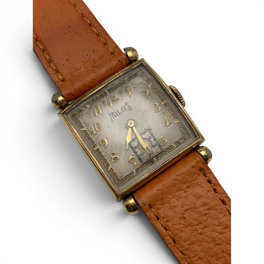 Vintage Milos Wrist Watch: Marked On Face: MilosMarked On Back: Base MetalMarked On Band: Kreisler, Genuine Pigskin8 7/8" Long - 22.75mm Face Diameter