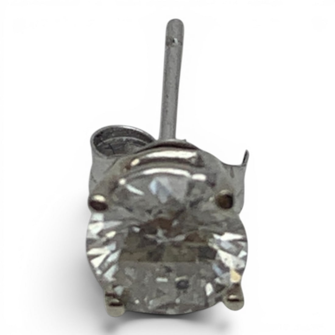 Single 14k White Gold & Solitaire Diamond Earring: 14k White Gold Earring Featuring 1 Round Cut Earth Mined Diamond Approx. 0.65ct.Marked 14k - 1/8" Diameter - 0.3 DwtGemstones Tested With Presidium Gem Tester Il - Berners Does Not Guarantee Authentic