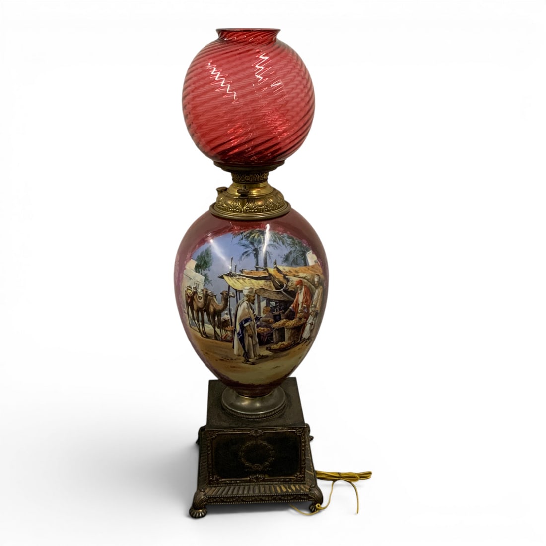 Victorian Gone With The Wind Cranberry Parlor Lamp: Victorian Gone With The Wind Parlor Lamp Featuring A Prominent Hand Painted Glass Base Depicting Ab Arabic Scene Topped With A Swirled Cranberry Red Glass Shade.Hand Painted Scene Signed Lower Left: L