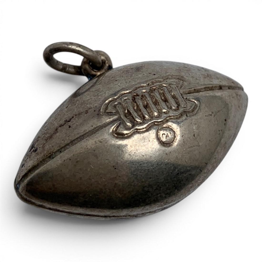 Sterling Silver Football Charm: Sterling Silver Charm Featuring A Football DesignMarked: Sterling - 1" Long - 4.2 Grams