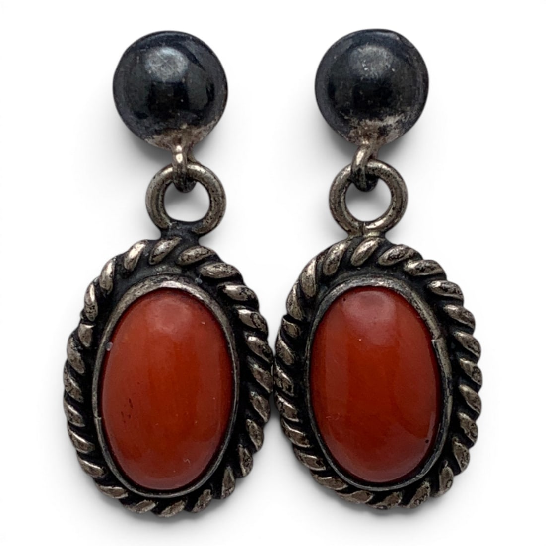Pair Of Silver & Orange Coral Earrings: Pair Of Silver Earring Featuring Oval Cut Orange Coral Set In The Middle Tests Silver - 1" Long - 5.7 Grams