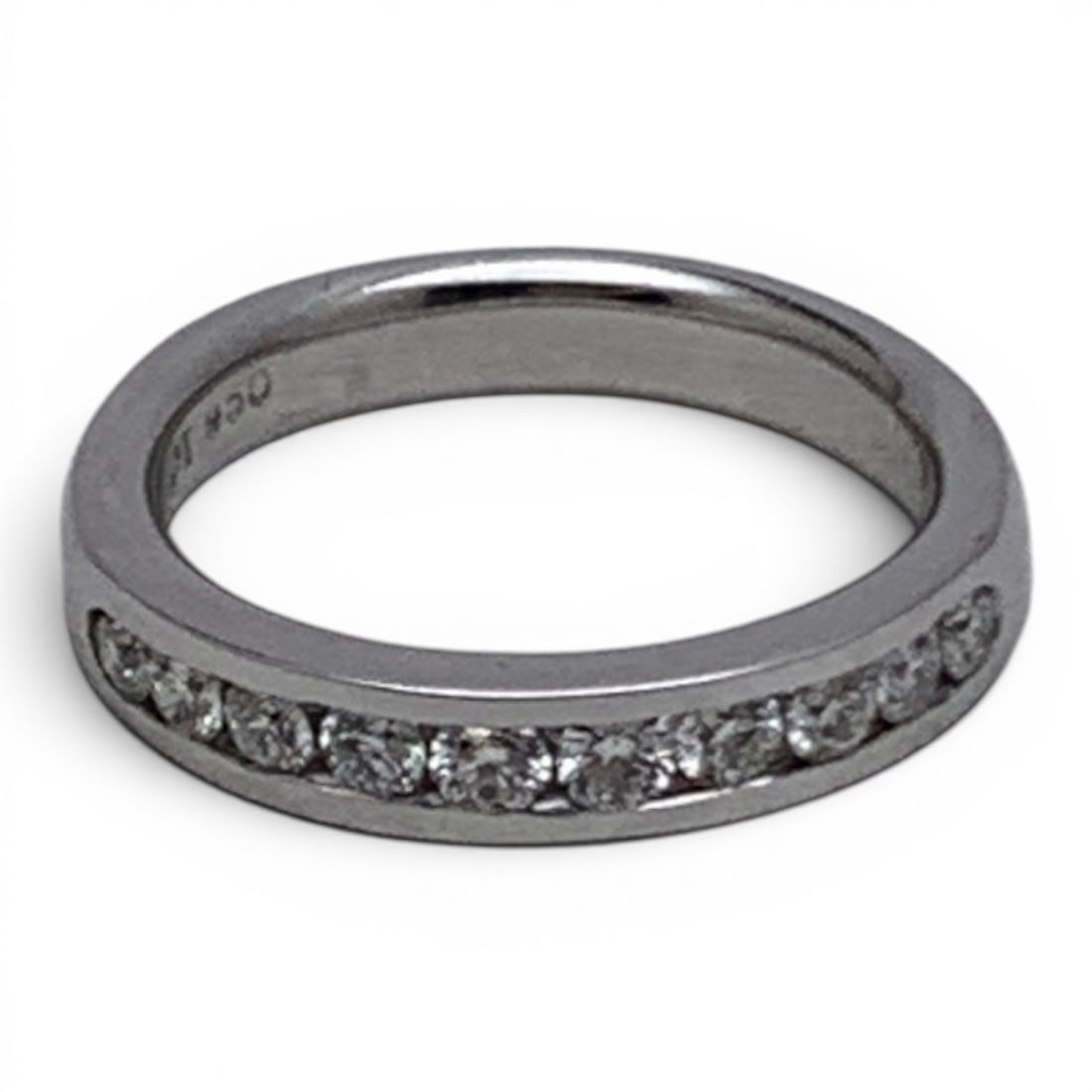 Platinum & White Sapphire Ring: Platinum Ring Featuring 10 Round Cut Channel Set White SapphiresMarked: Pt 950 - Size 6.75 - 5.2 DwtGemstones Tested With Presidium Gem Tester Il - Berners Does Not Guarantee Authenticity Of Gemstones