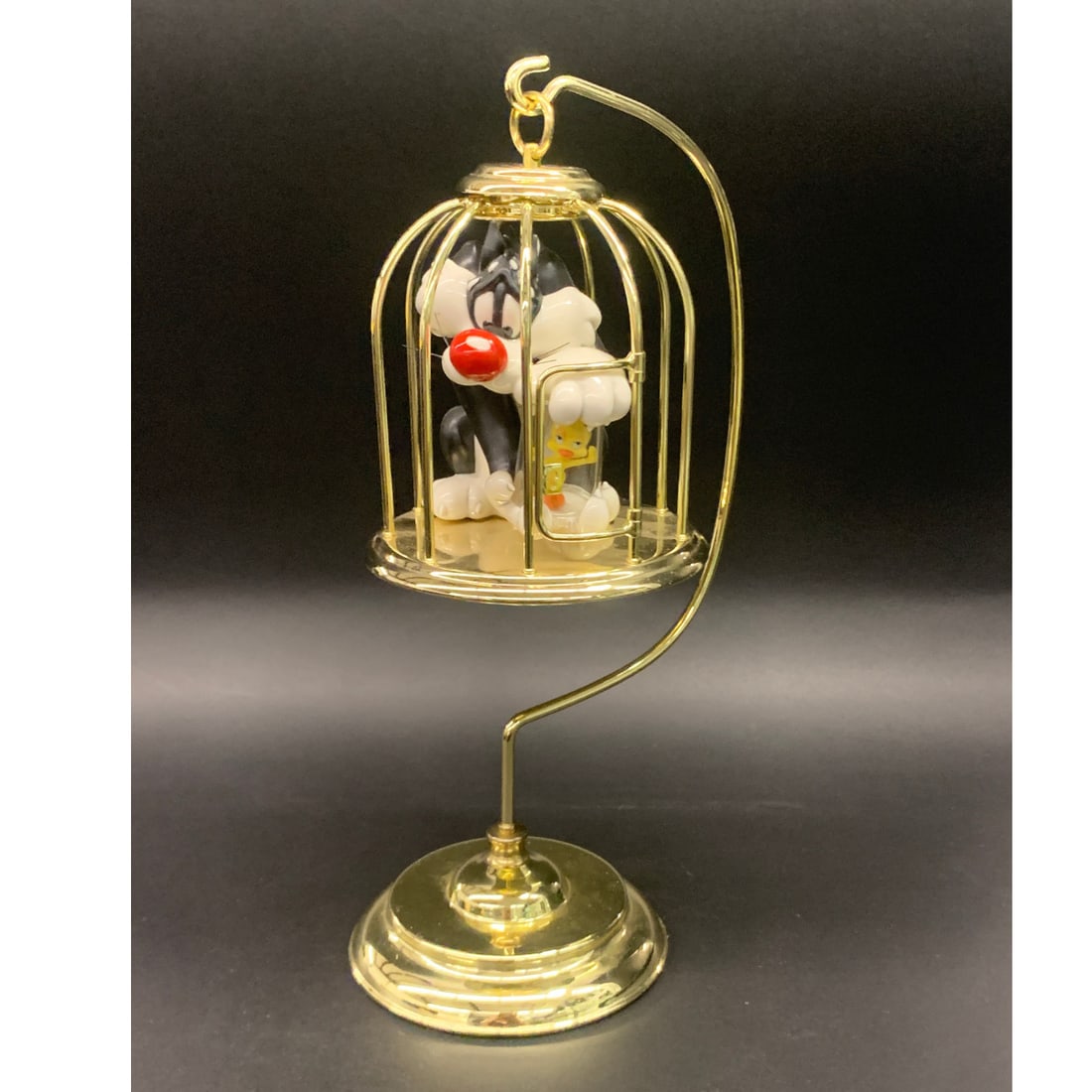 Goebel Looney Tunes Sylvester & Tweety In Cage: Marked: Looney Tunes. Spotlight Collection. Goebel. Bad Ol'puddy Tat. 1150/5,098. T. M. & 1997 Warner Bros. 13.25" Total Height Brass Cage.