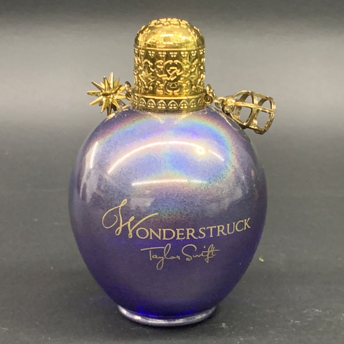 Taylor Swift Wonfderstyruck Eau De Parfum Spray: Purple Iridescent Finish With Gold Charms. 4.25" Tall.