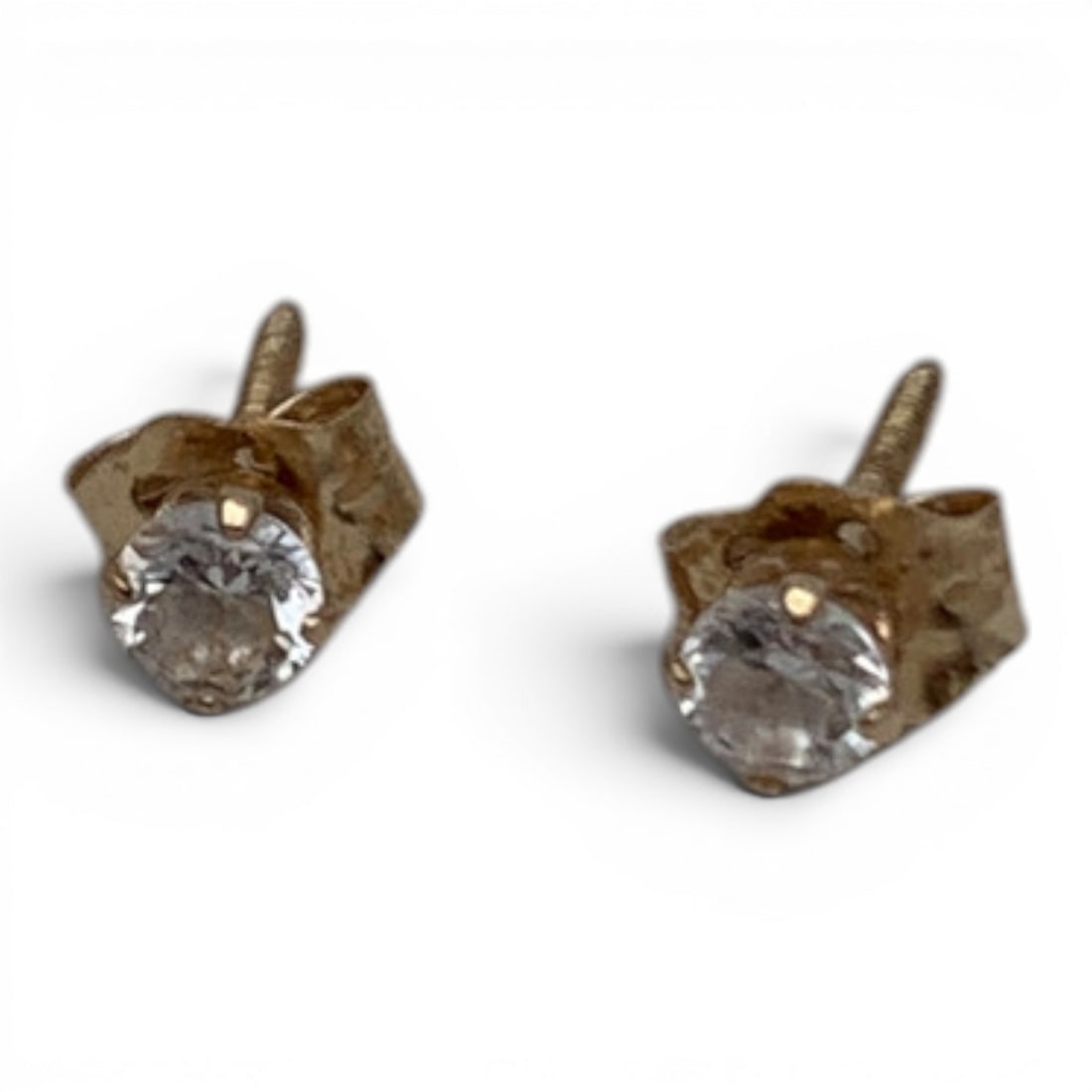 Pair Of 14k Yellow Gold & Clear Stone Earrings: Pair Of 14k Yellow Gold Earrings Featuring A Round Cut Clear Stone Marked 14k - 1/8" Diameter - 0.2 Dwt