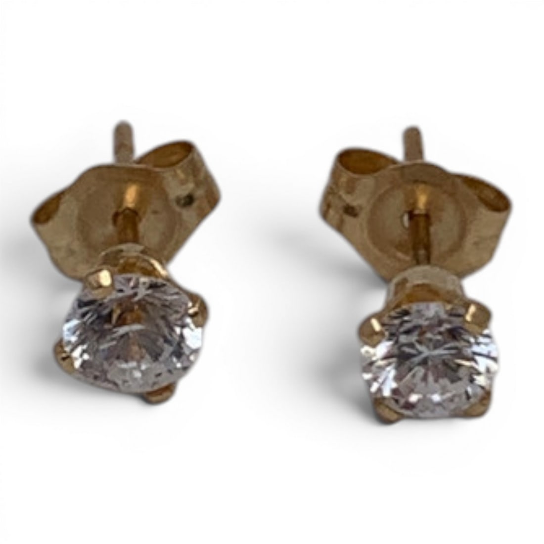 Pair Of 14k Yellow Gold & Clear Stone Earrings: Pair Of 14k Yellow Gold Earrings Featuring A Round Cut Clear Stone Marked 14k - 1/8" Diameter - 0.3 Dwt