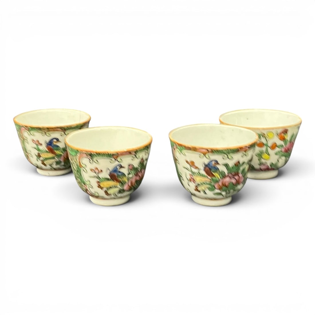 Set Of 4 Chinese Famille Rose Porcelain Cups: Set Of 4 Chinese Famille Rose Porcelain Cups Featuring Hand Painted Figures And Floral Motifs2" Tall1 Cup Shows Complete Crack - See Photos
