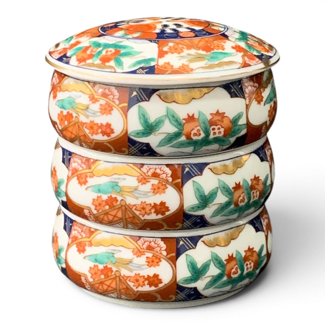 Japanese Imari Style Porcelain Stacking Jubako: Signed Japanese Imari Style Porcelain Stacking Jubako Featuring 3 Removable Tiered Bowls With A Matching Fitted LidSigned On Bottom: 4" TallBottom Bowl Is Cracked And Shows Damage