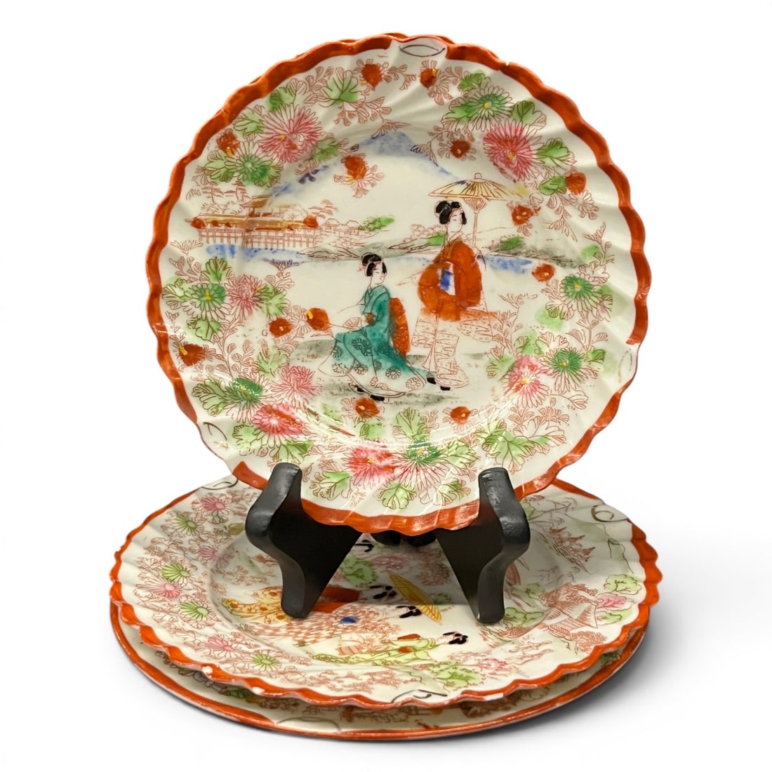 4 Vintage Japanese Porcelain Plates: 4 Vintage Japanese Porcelain Plates Featuring Hand Painted ScenesBears Mark On Bottom2 Small Scalloped Rim Plates: 6 1/4" Diameter1 Large Scalloped Rim Plate: 7 3/8" Diameter1 Smooth Rim Plate: 7 1/8"