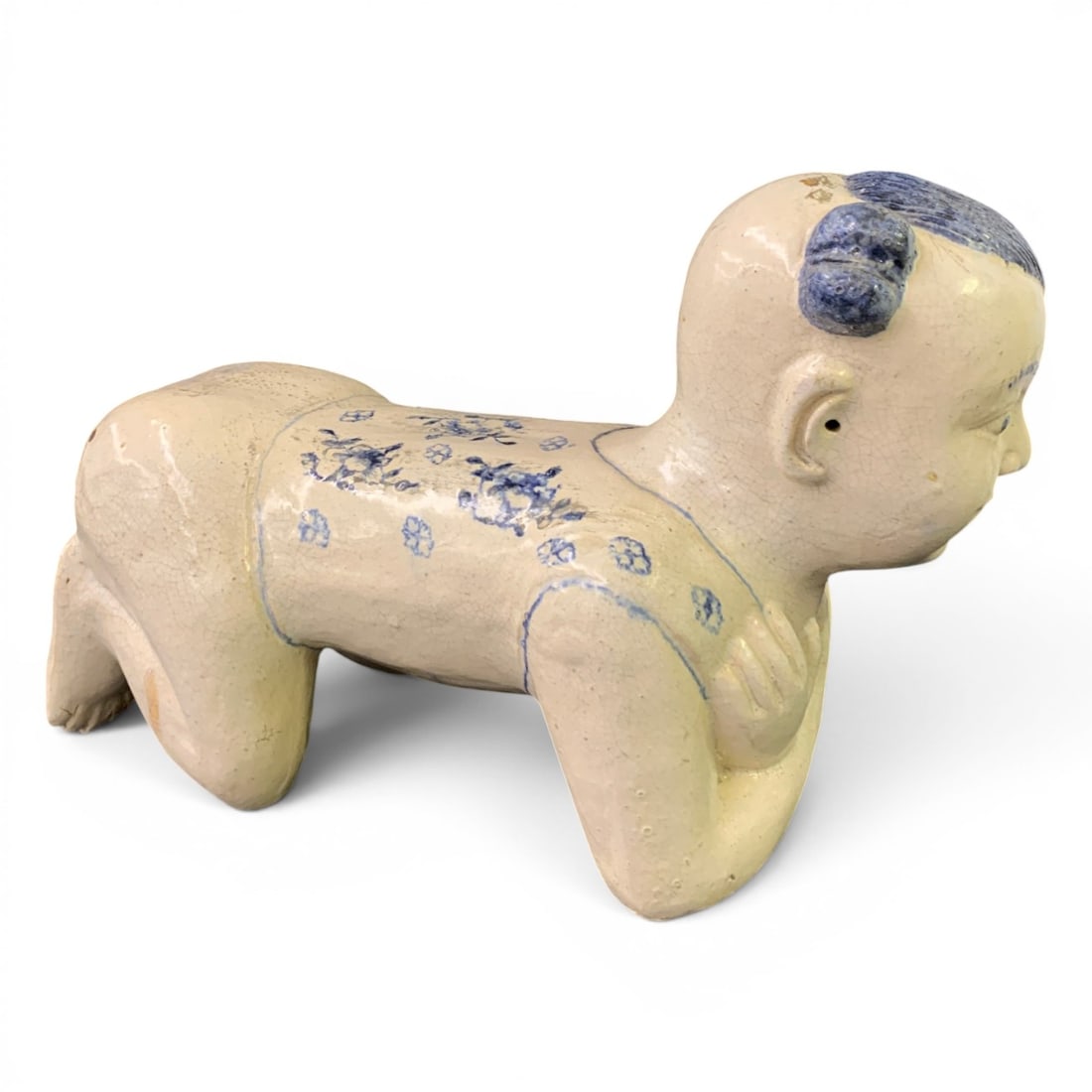 Antique Chinese Ceramic Pillow Rest: Antique Chinese Ceramic "crouching Boy" Pillow Rest Featuring Blue And White Floral Designs On A White Glazed Base 15" Long - 10" Tall