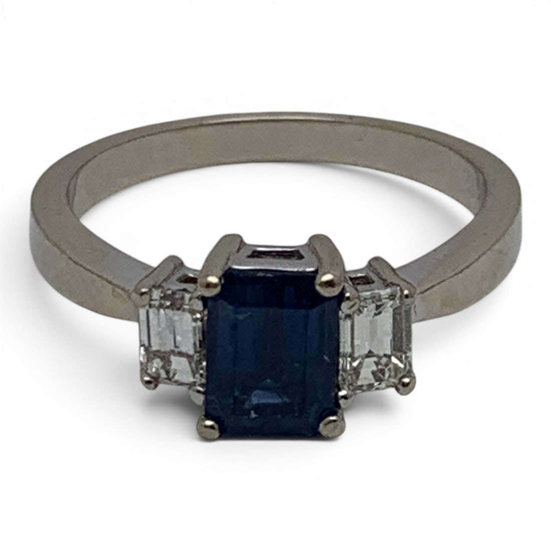 14k White Gold Diamond & Sapphire Ring: 14k White Gold Ring Featuring A Center Set Rectangular Cut Blue Sapphire Gemstone Flanked By 2 Rectangular White Diamonds Approx. 0.24ct Each.Marked 14k - Size 8 - 2.8 DwtGemstones Tested With