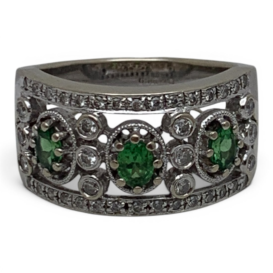 18k White Gold Diamond & Green Citrine Ring: 18k White Gold Ring Featuring 3 Oval Cut Green Citrine Gemstones Flanked By 12 Round Cut White Diamonds Approx. 0.025ct Each. Set Along The Band Are 30 Round Cut Diamonds Approx. 0.014ct Each.Marked