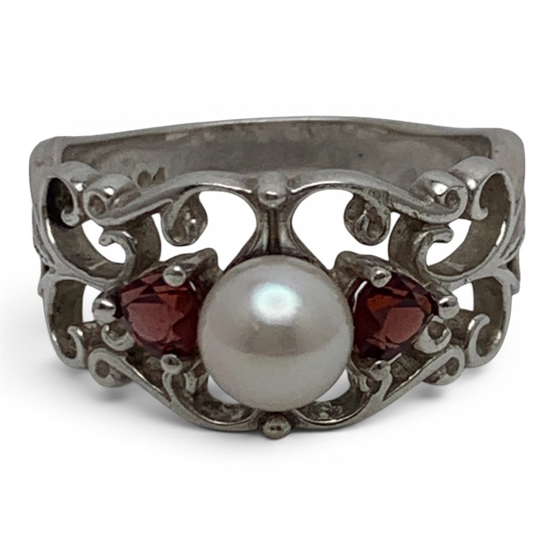 Sterling Silver Pearl & Red Stone Ring: Sterling Silver Ring With An Open Work Design Featuring A Center Set Round White Pearl Flanked By Two Heart Cut Red Gemstones Marked: Ster - Size 9 - 5.5 Grams
